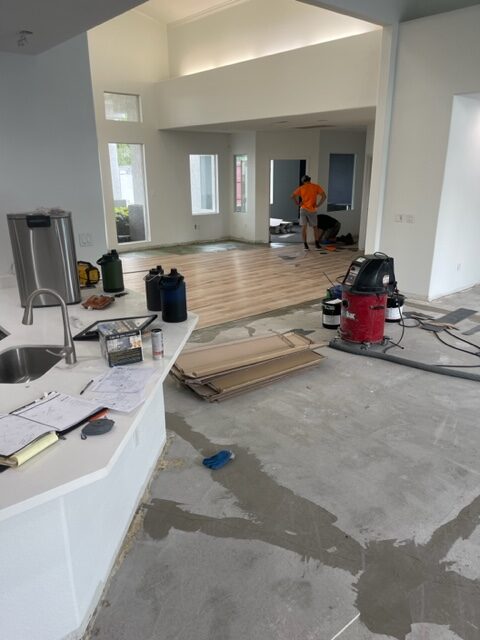 A kitchen is being remodeled with hardwood floors.